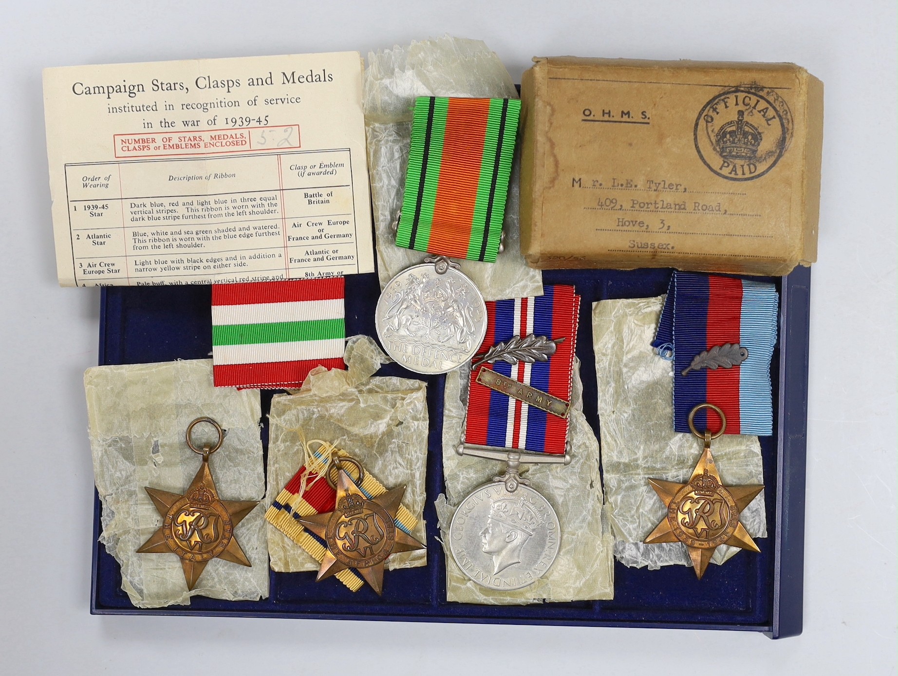A WWII group of 5 including war medal with oak leaf and 1939-45 star with oak leaf to L.E. TYLER, 8th Army bar (with named box)